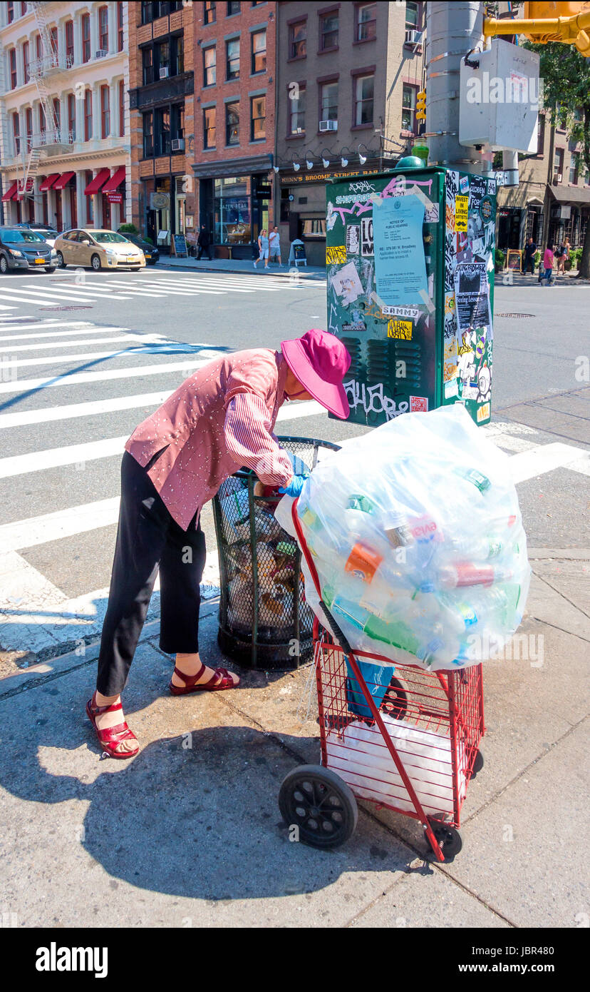 Senior Asian woman collecting cans and bottles for the deposit Stock