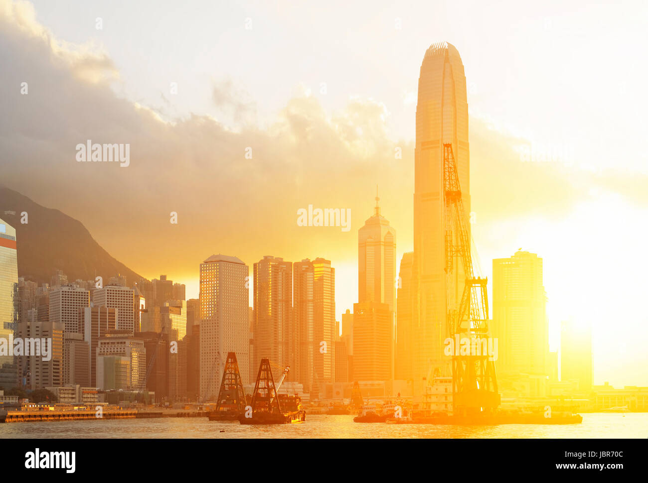 Hong Kong sunset with office buildings Stock Photo - Alamy
