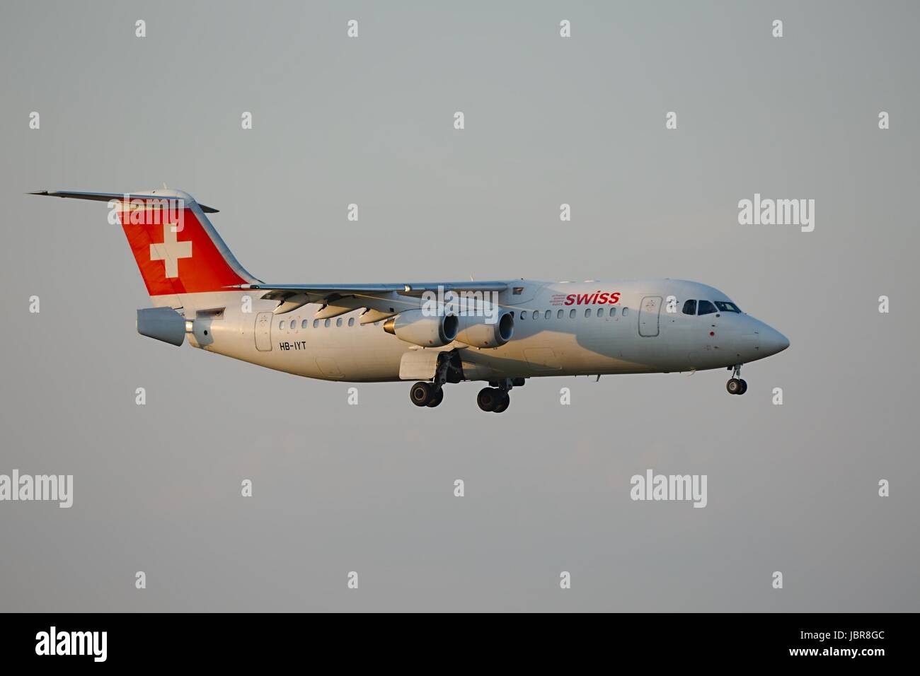 BUDAPEST, HUNGARY - APRIL 7: Swiss airliner approaching Budapest Liszt Ferenc Airport, April 7th 2014. Swiss International Air Lines is Switzerland's flag carrier airline. Stock Photo