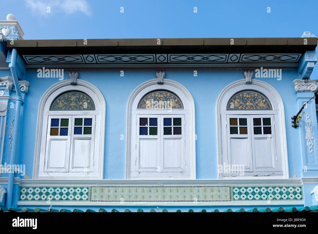 Typical Peranakan-style (Baba-Nyonya, or Straits Chinese) façade mixing Chinese and colonial architectural elements, Melaka, Malaysia. Stock Photo