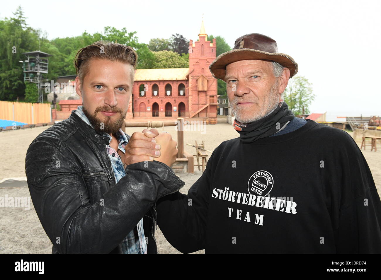 The actor of the pirate Klaus Stoertebeker, Bastian Semm (L), stands with the former actor of Stoertebeker (1993 - 2001) Norbert Braun, at the Nature Stage Ralswiek, Germany, 30 May 2017. The Stoertebeker Festival has been taking place for 25 years on the island of Ruegen. Photo: Stefan Sauer/dpa-Zentralbild/dpa Stock Photo