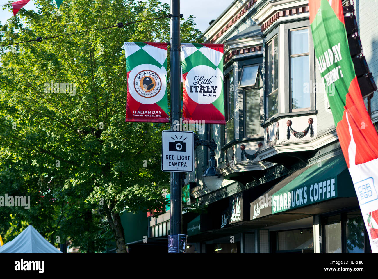 Vancouver, BC, Canada. 11th June, 2017. Colourful banners on Commercial Drive in Vancouver seen at this year's 'Italian Day on the Drive'. The annual Italian street festival is located in Vancouver's 'Little Italy' in the Grandview-Woodland neighbourhod, and draws large crowds. Credit: Maria Janicki/Alamy Stock Photo