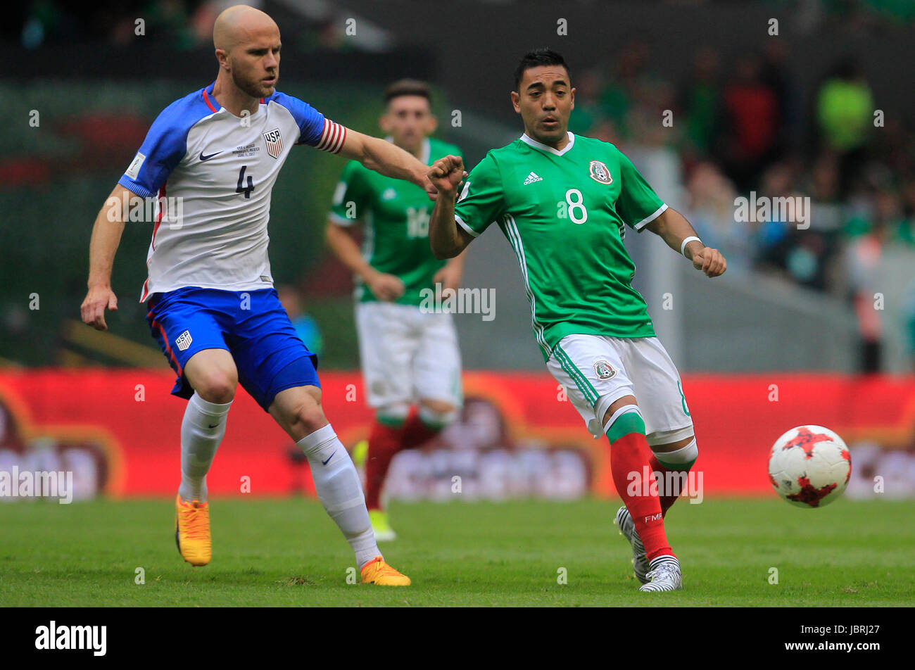 Mexico City, Mexico. 11th June, 2017. Mexico's Marco Fabian (R) vies for the ball during a World Cup soccer qualifying match in the Azteca Stadium, in Mexico City, capital of Mexico, on June 11, 2017. The match ended in a 1-1 tie. Credit: Str/Xinhua/Alamy Live News Stock Photo