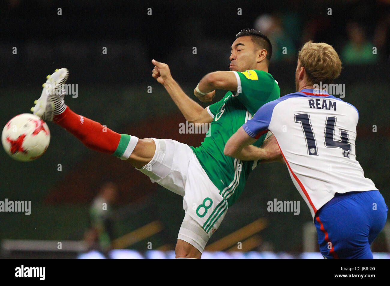 Mexico City, Mexico. 11th June, 2017. Mexico's Marco Fabian (L) vies for the ball during a World Cup soccer qualifying match against United States, in the Azteca Stadium, in Mexico City, capital of Mexico, on June 11, 2017. The match ended in a 1-1 tie. Credit: Str/Xinhua/Alamy Live News Stock Photo