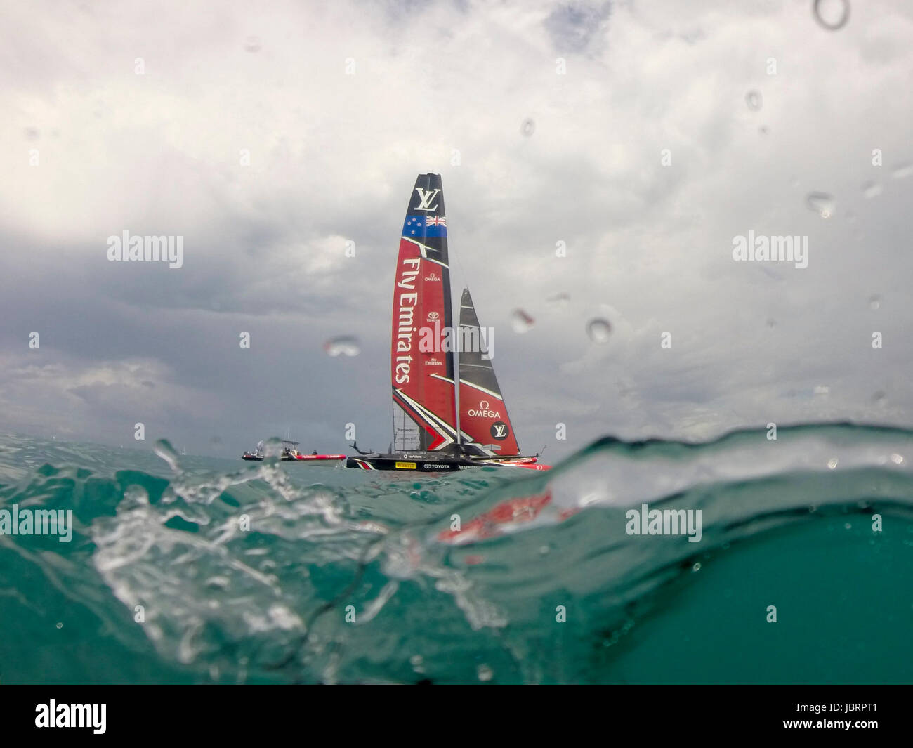 The Great Sound, Bermuda 12th June 2017. Emirates Team New Zealand waits for race seven of the Louis Vuitton America's Cup Challenger series to be re started after the first attempt was abandoned when race time limit was exceeded. Credit: Chris Cameron/Alamy Live News Stock Photo