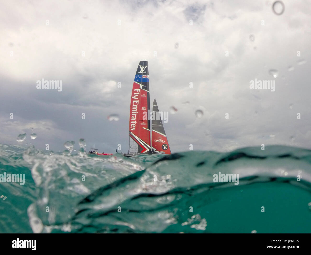 The Great Sound, Bermuda 12th June 2017. Emirates Team New Zealand waits for race seven of the Louis Vuitton America's Cup Challenger series to be re started after the first attempt was abandoned when race time limit was exceeded. Credit: Chris Cameron/Alamy Live News Stock Photo