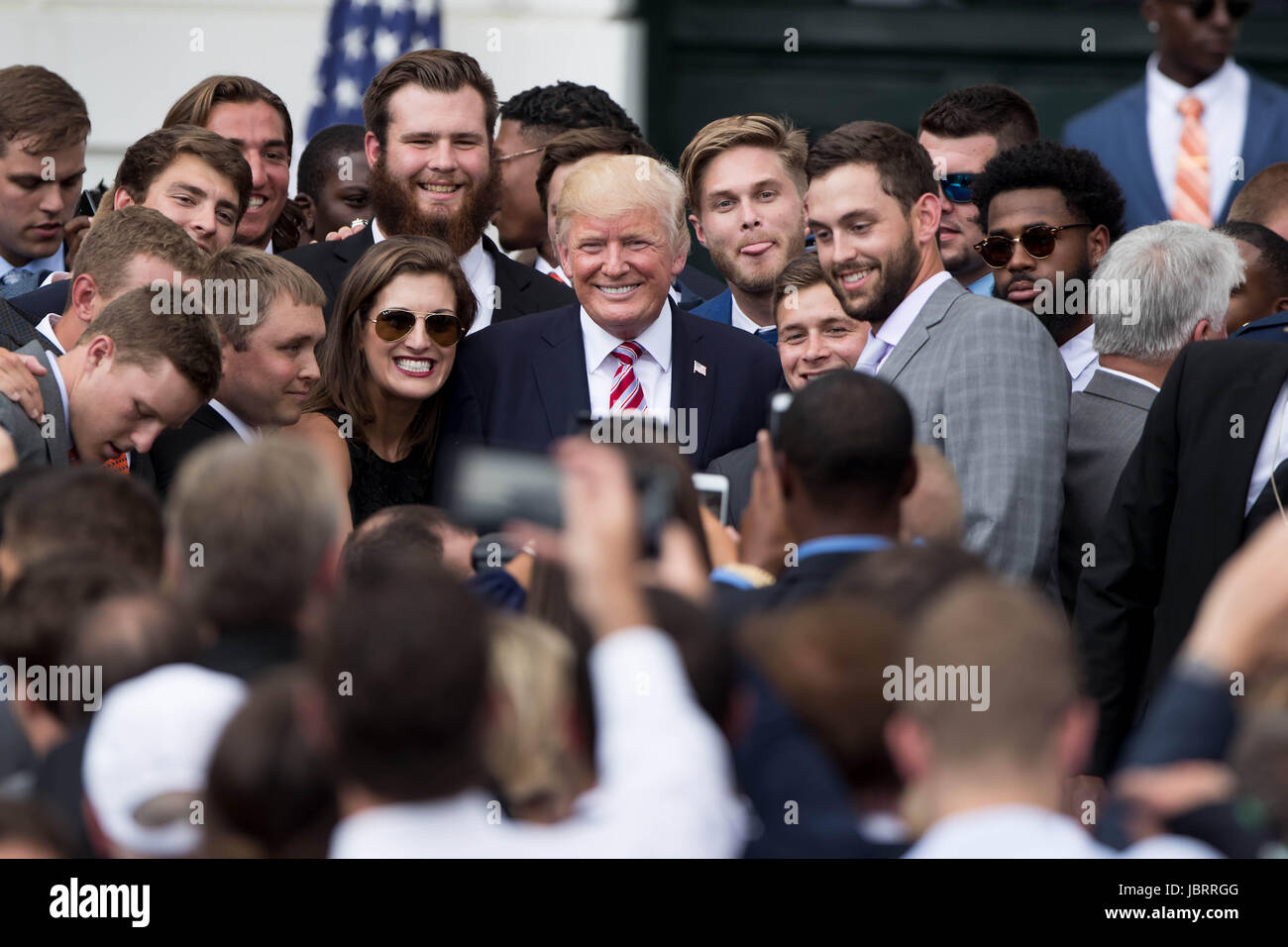 Washington, DC, USA. 12th June, 2017. U.S. President Donald Trump poses for photos during a ceremony honoring the 2016 NCAA Football National Champions Clemson University Tigers at the White House in Washington, DC, the United States, on June 12, 2017. Credit: Ting Shen/Xinhua/Alamy Live News Stock Photo