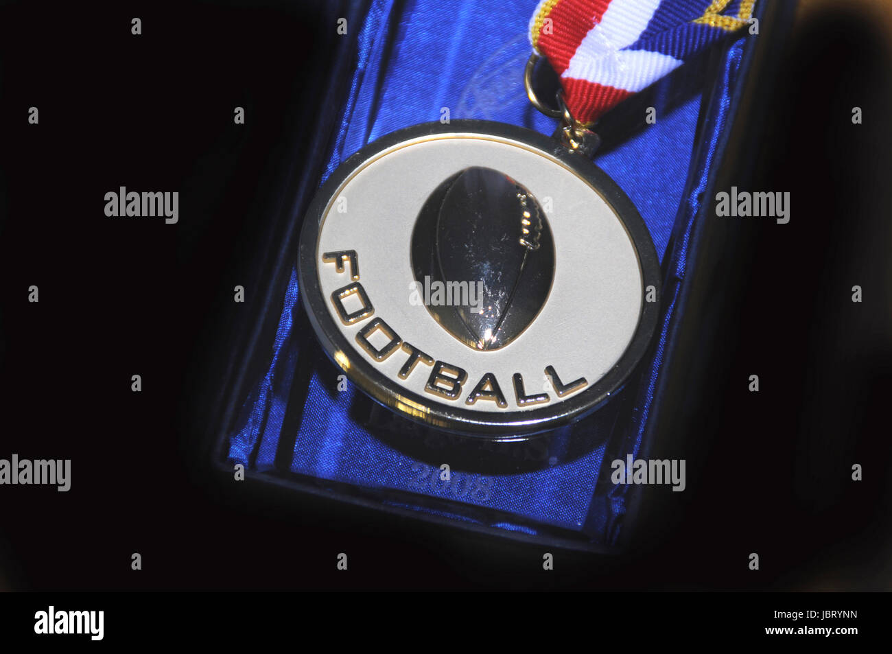 a medal to be awarded a teenager who excels in football Stock Photo