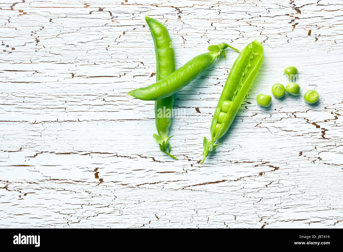 top view of green pea pods on old cracked background Stock Photo - Alamy