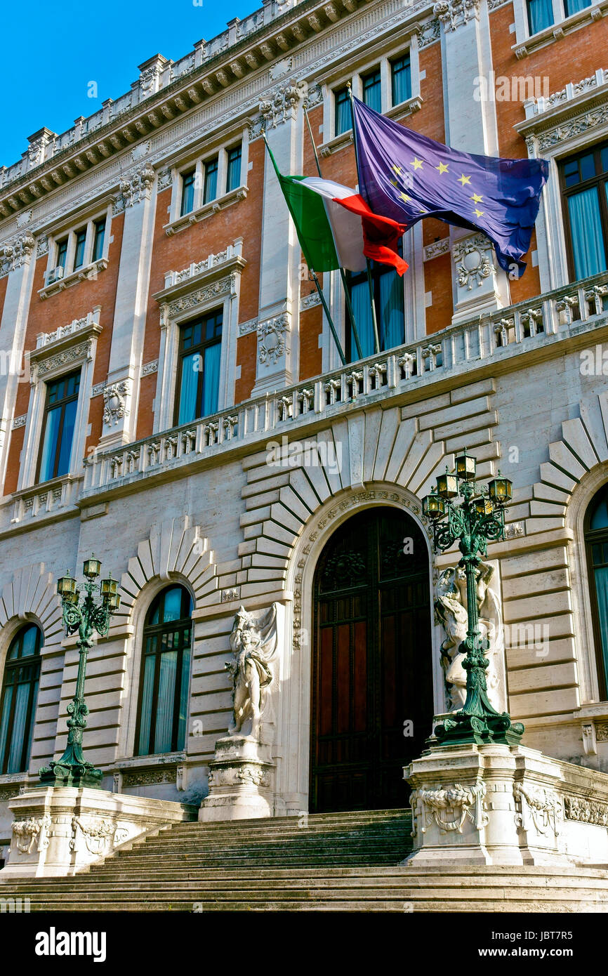 Palazzo Montecitorio. Chamber of Deputies of the Italian Republic. Italian Parliament. Camera dei deputati. Flying European, Italian flag. Rome, Italy Stock Photo
