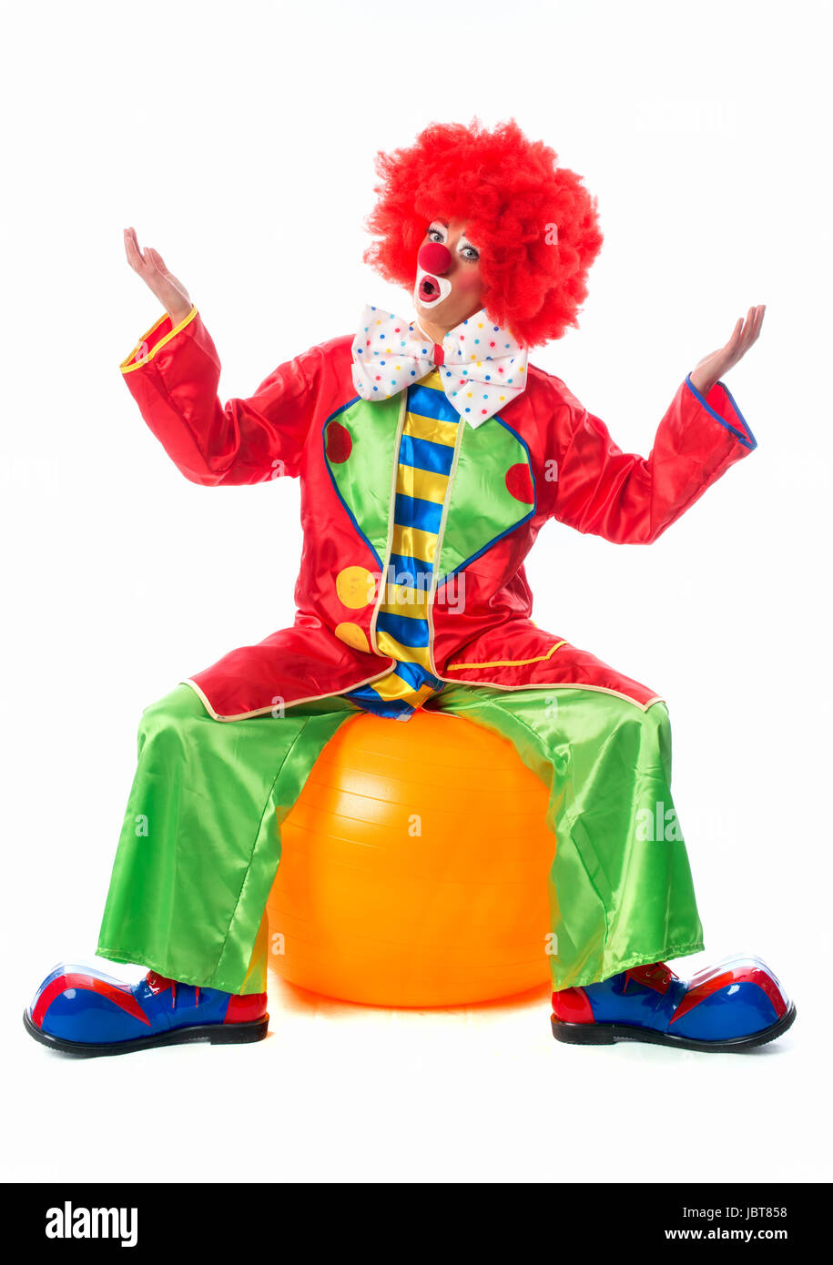 clown sitting on exercise ball Stock Photo