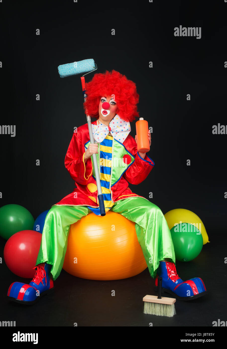 clown as a house painter Stock Photo