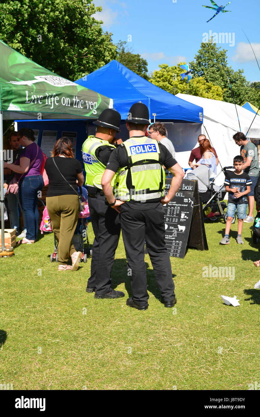 Police Officers looking at food stall menu at the Kite Festival in ...