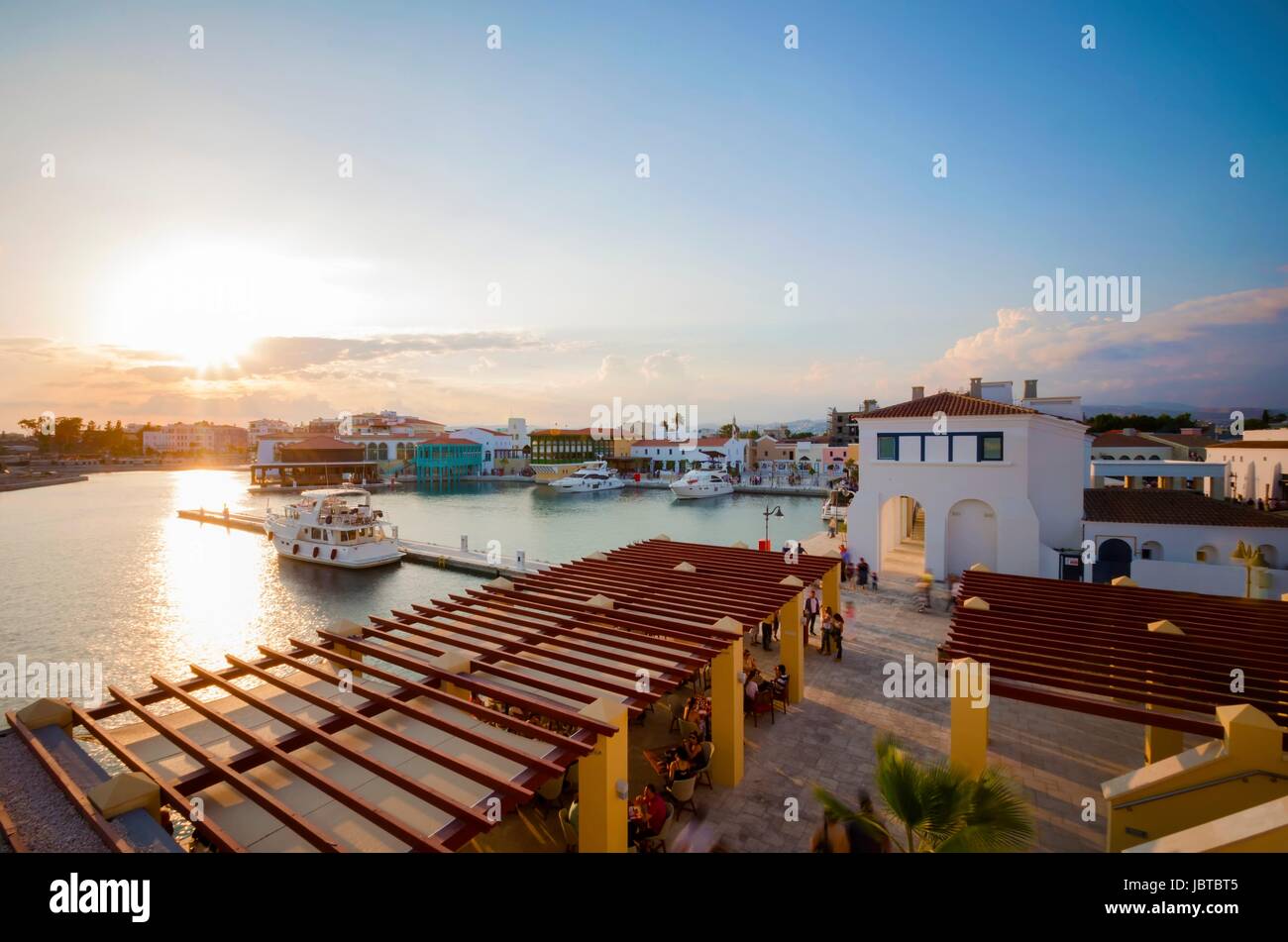 The beautiful Marina in Limassol city in Cyprus. A very modern, high end and newly developed area where yachts are moored and it's perfect for a waterfront promenade. A view of the commercial area at sunset. Stock Photo