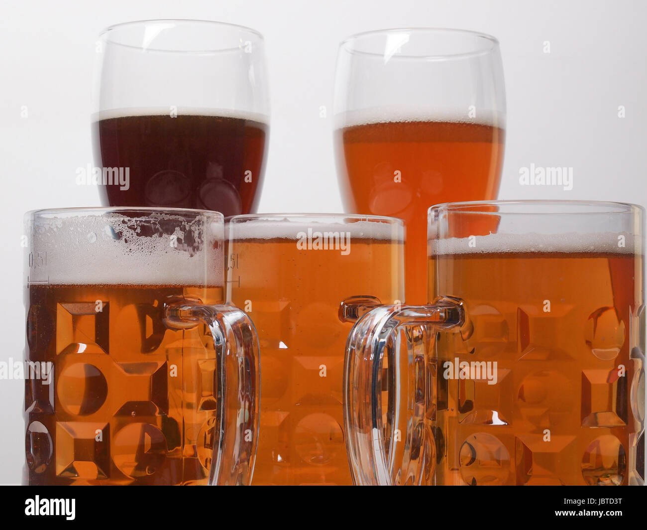 Many glasses of German beers including weiss dunkel and lager Stock