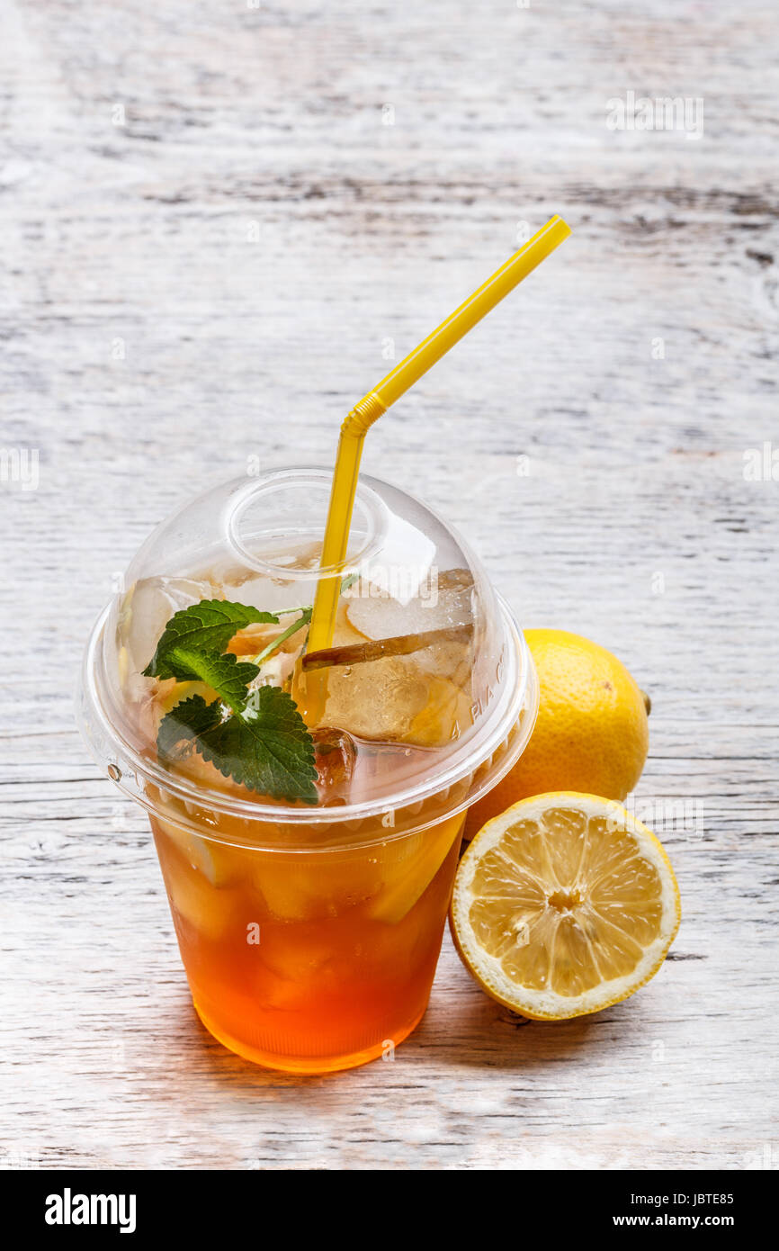 https://c8.alamy.com/comp/JBTE85/iced-tea-in-plastic-cup-with-lemon-and-mint-JBTE85.jpg