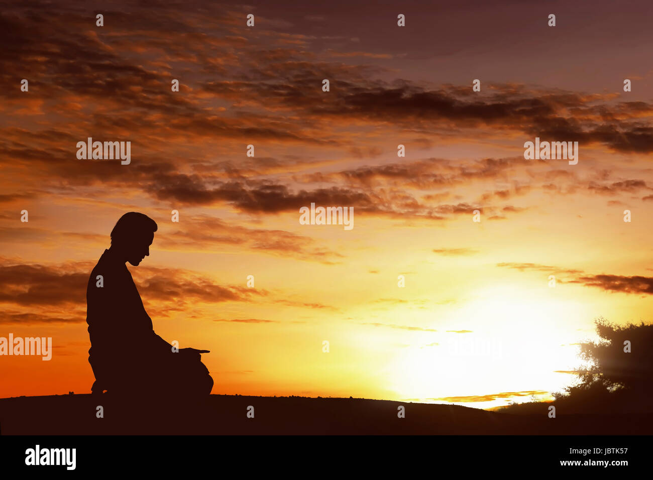 Silhouette of asian muslim man praying on a hilltop at sunset Stock ...