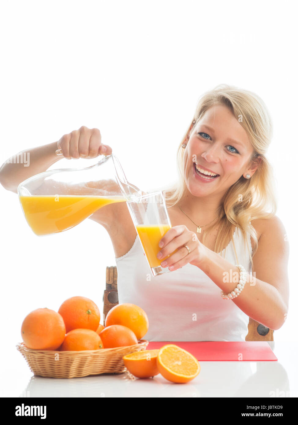 blonde woman with orange juice Stock Photo