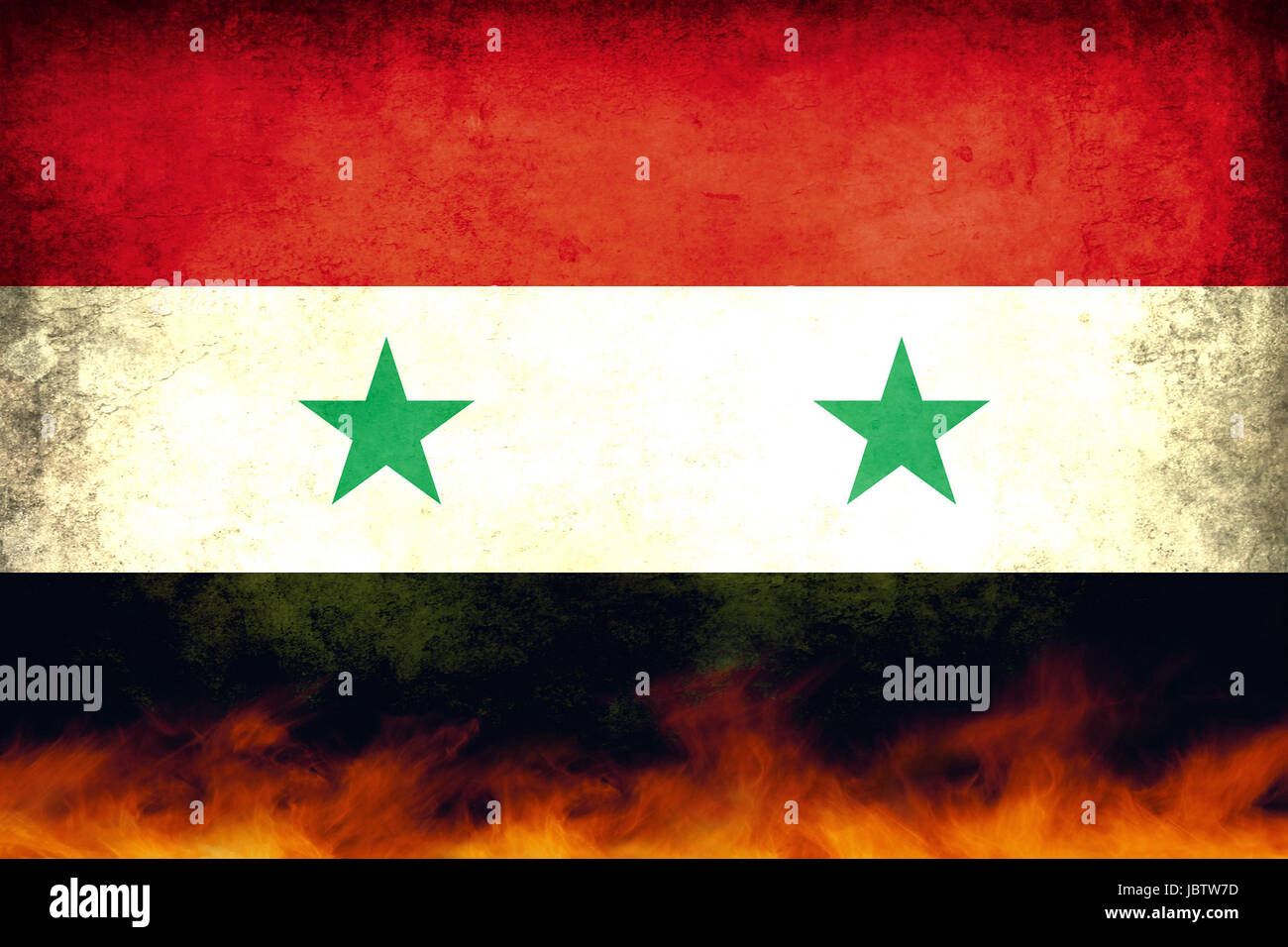 A damaged and burning Syria conflict flag Stock Photo
