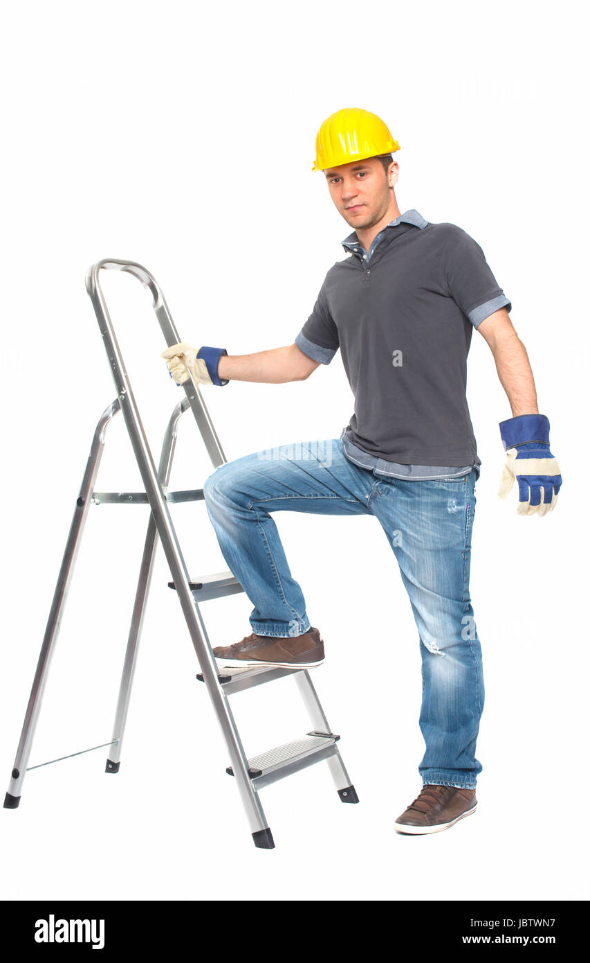 young man with construction helmet and stepladder Stock Photo