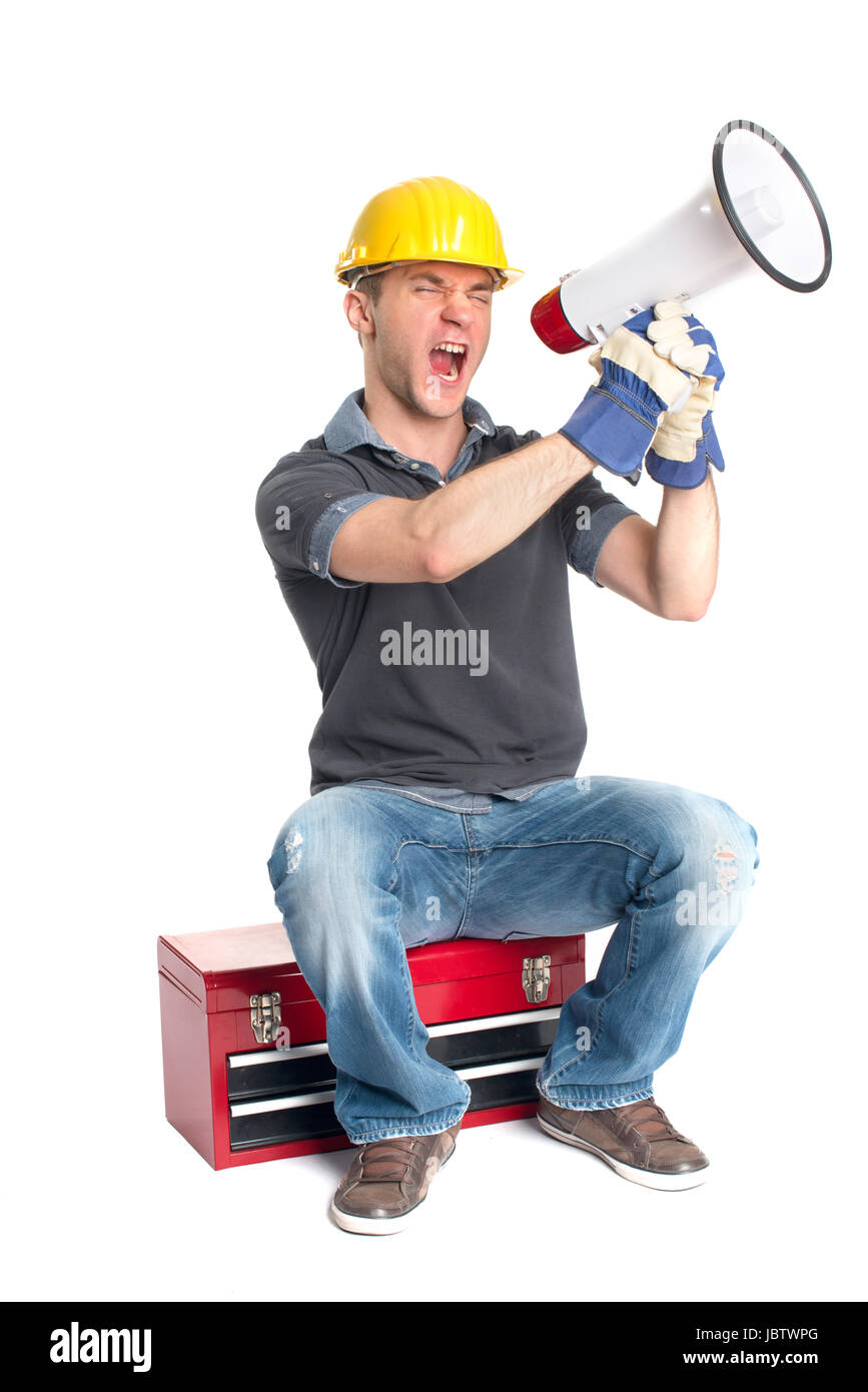 a craftsman sitting on a toolbox and holding a megaphone Stock Photo