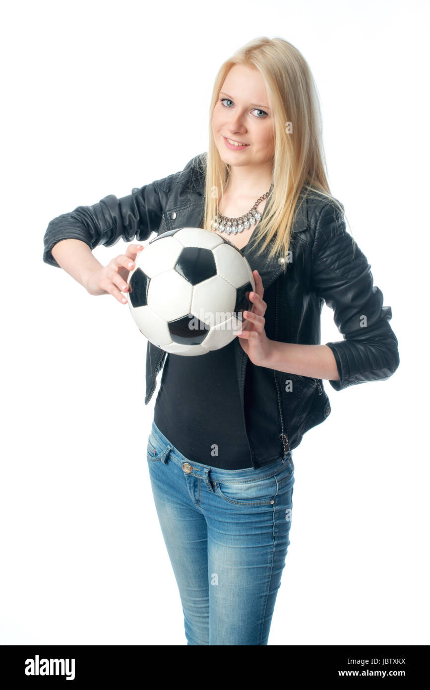 blond girl in leather jacket with football Stock Photo