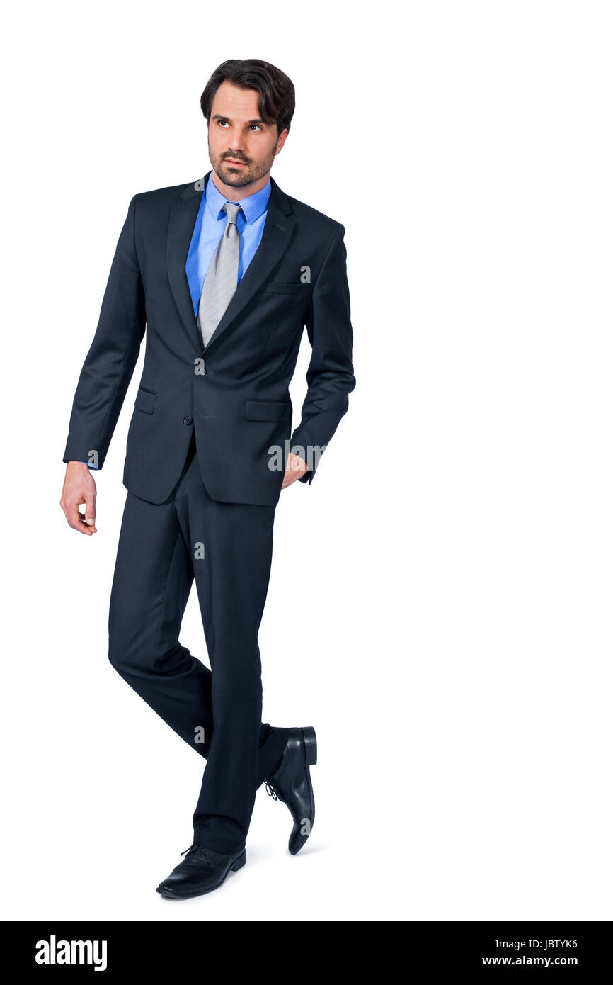 selbstbewuster junger Geschäftsmann mit Anzug dunklen Haaren und Bart isoliert vor weißem Hintergrund Stock Photo