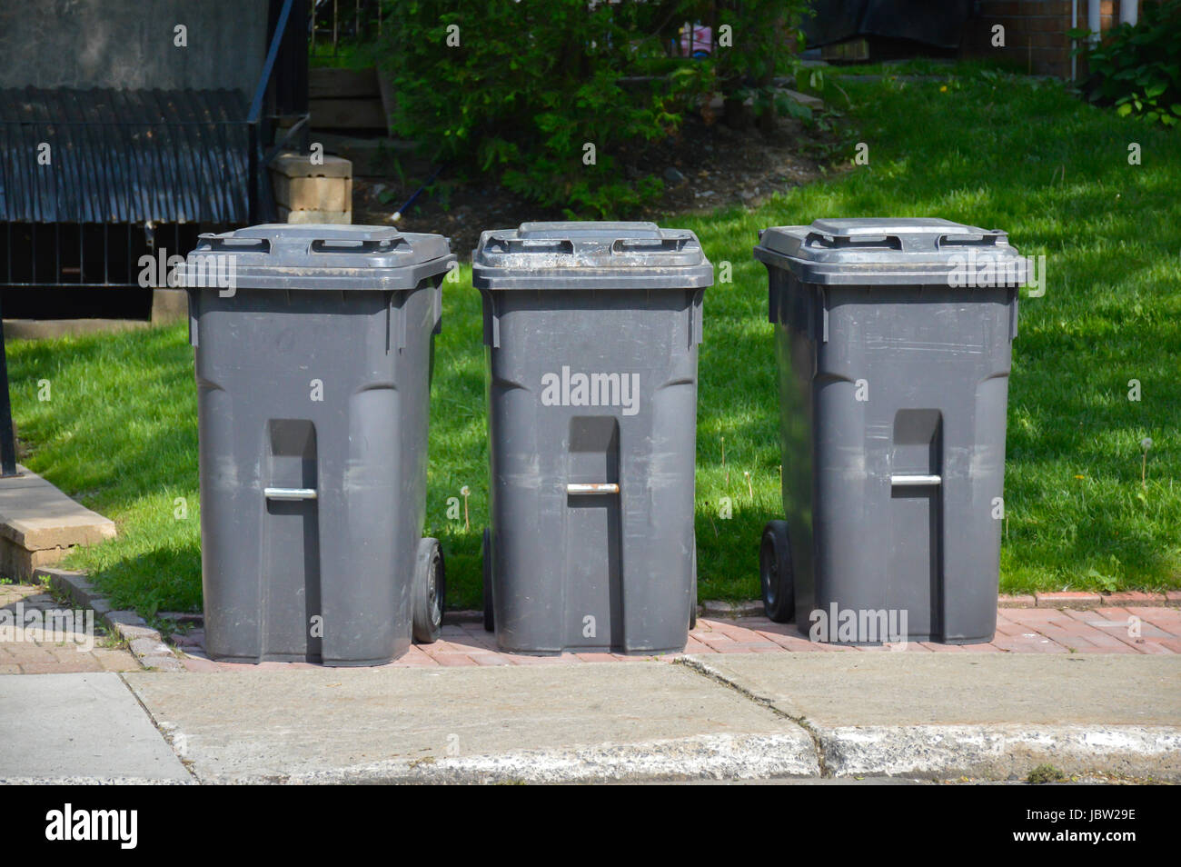 Black trash bins in Canada Stock Photo Alamy