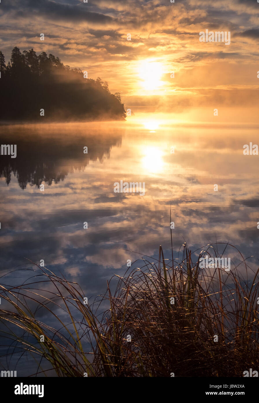 Scenic landscape with lake and beautiful sunrise at morning Stock Photo