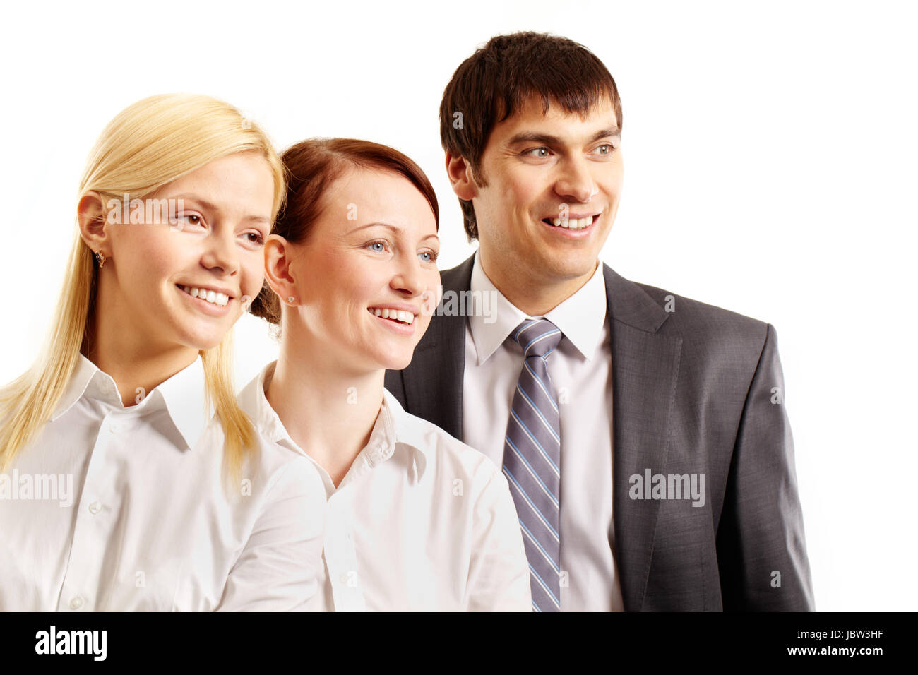 Three confident business people smiling and looking away isolated on white Stock Photo
