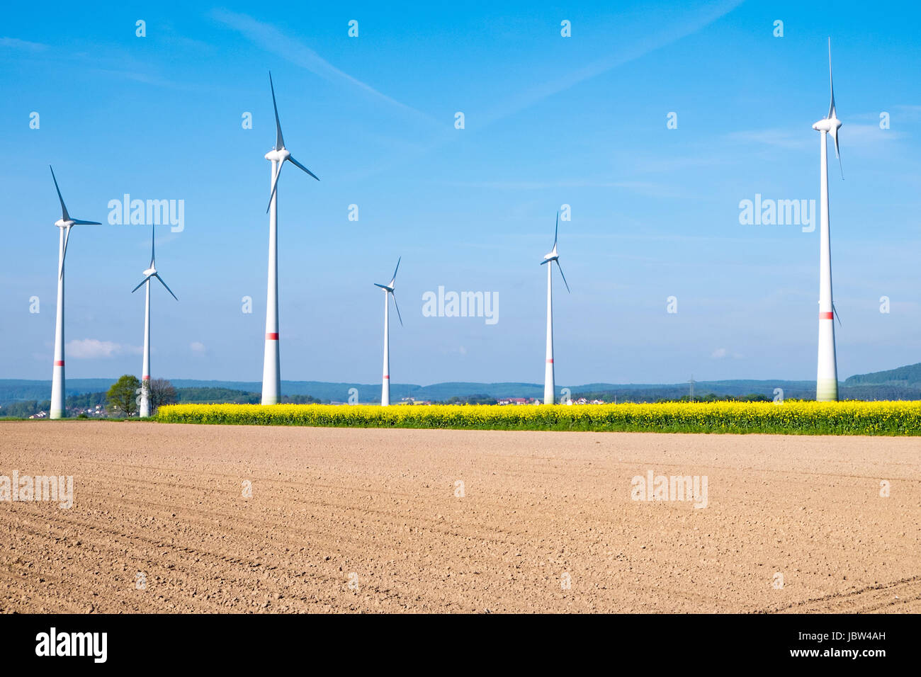 wind turbines behind a farm Stock Photo - Alamy