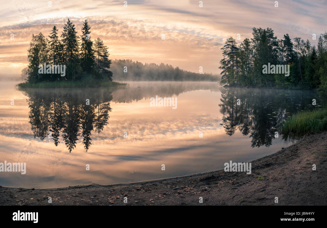 Scenic landscape with pond and fog at autumn morning Stock Photo