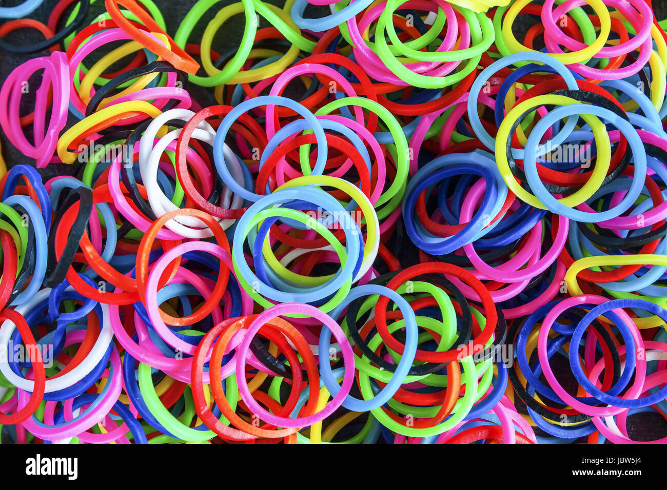 Colorful rainbow loom bracelet rubber bands Stock Photo - Alamy