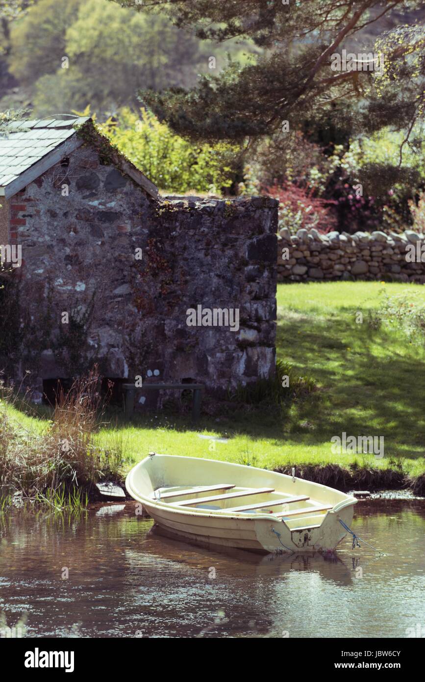 Local Rowing Boathouse Rowing boat in the water outside a boathouse Stock Photo - Alamy