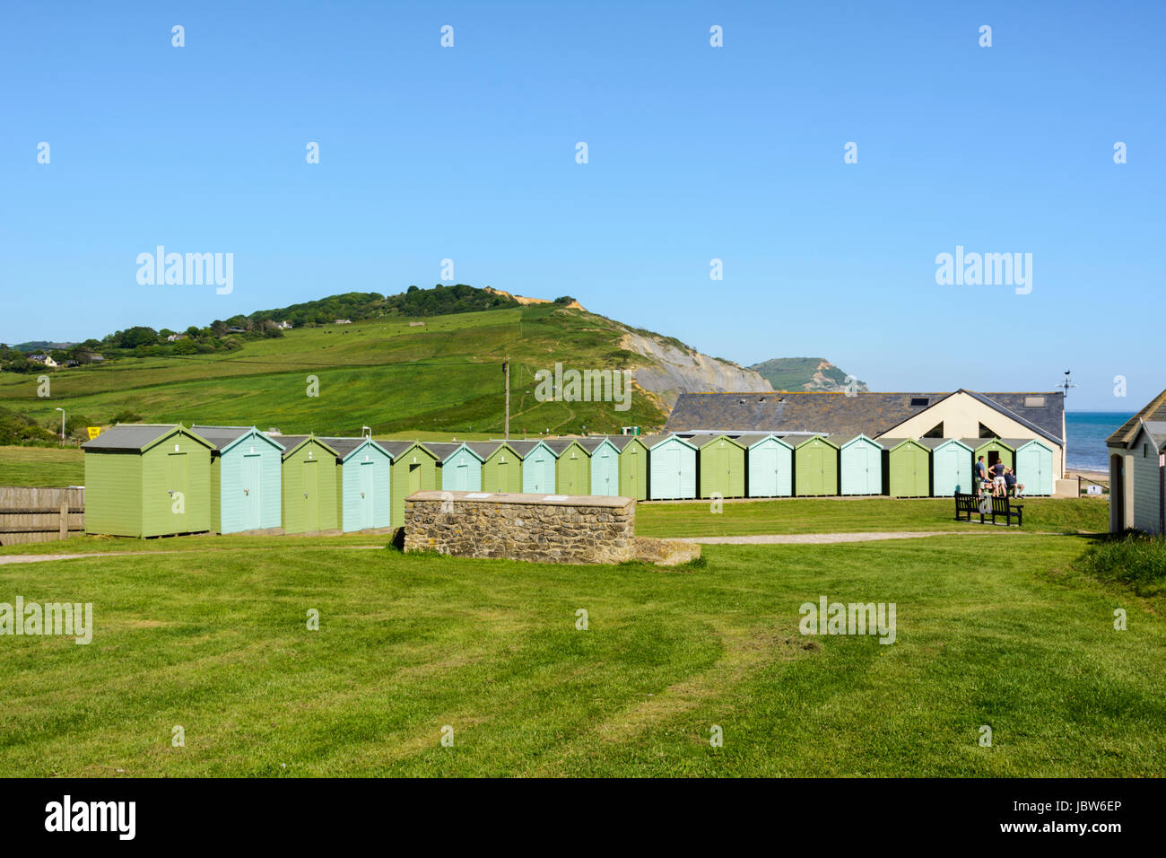 Traditional painted wooden beach huts in Charmouth, Dorset, England, UK, Europe Stock Photo