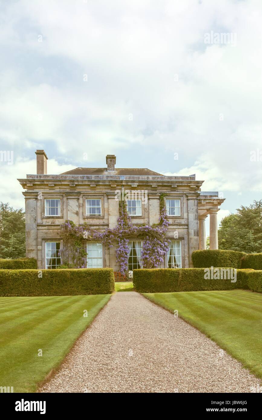 Country manor house in manicured gardens Stock Photo