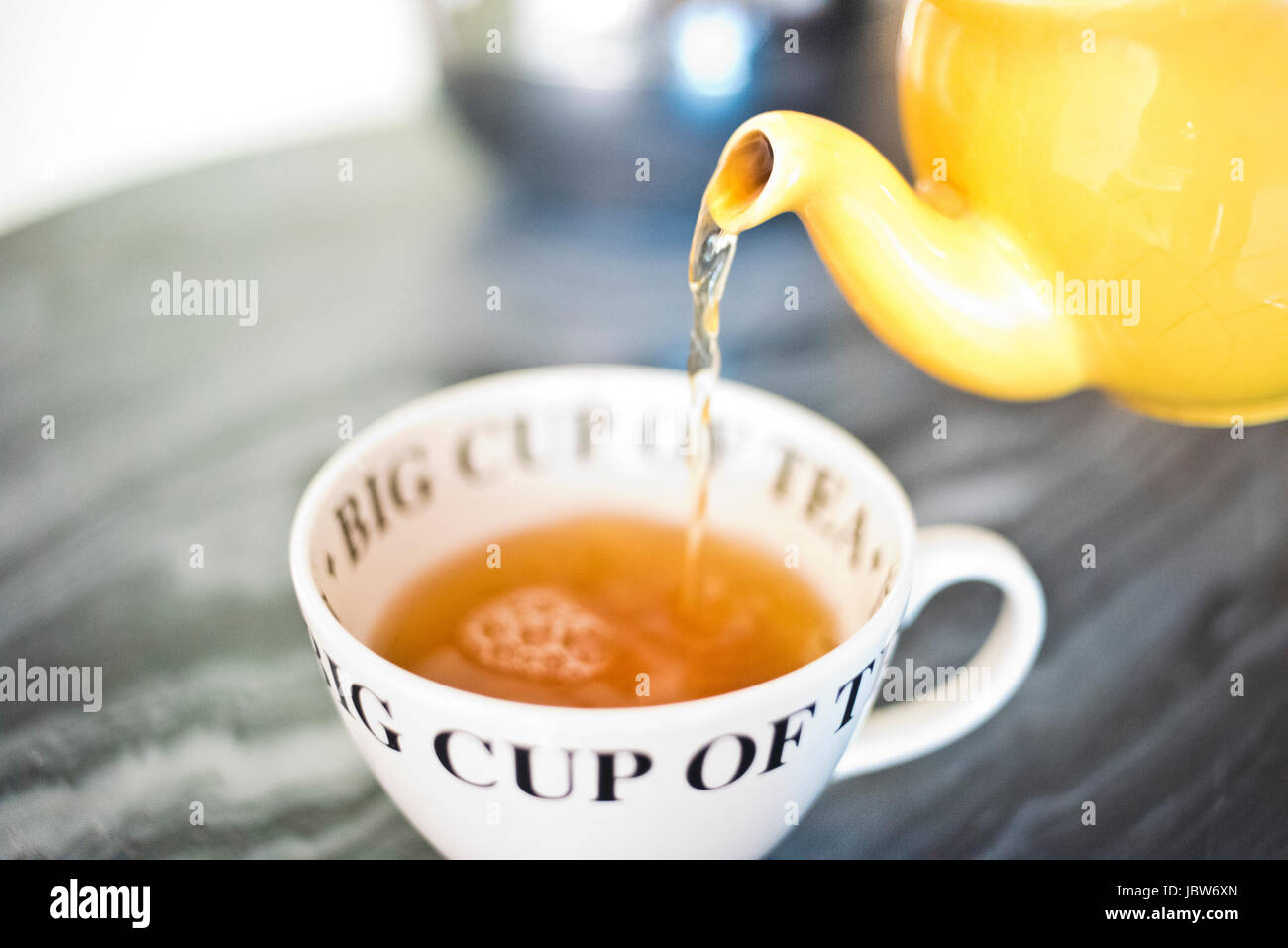 Teapot pouring out tea hires stock photography and images Alamy