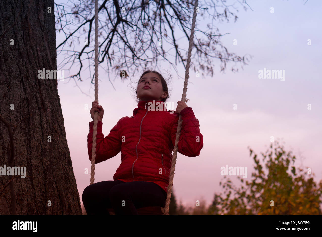 Girl on swing in park, Chusovoy, Russia Stock Photo