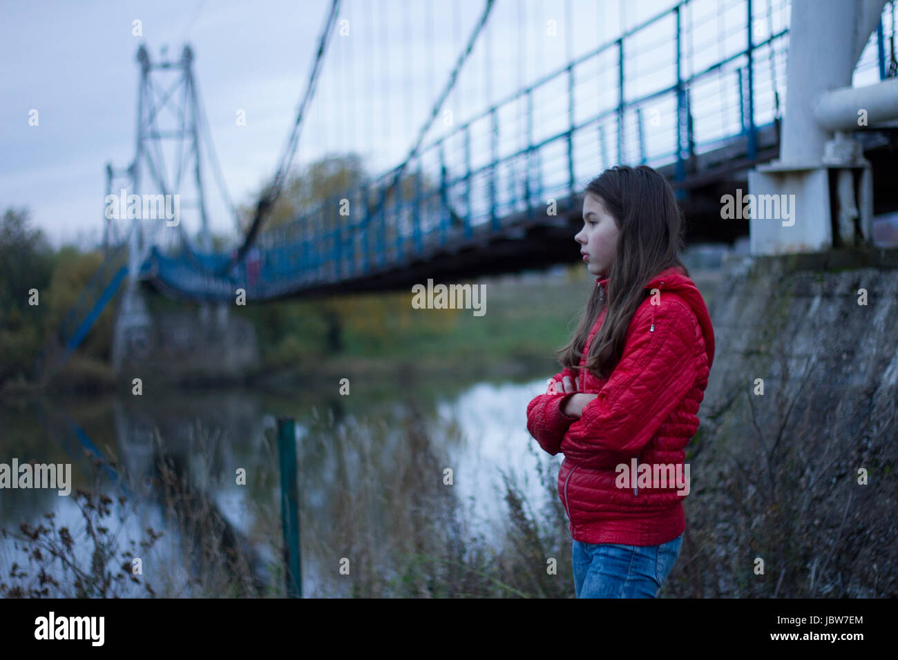 Girl by pedestrian bridge, Chusovoy, Russia Stock Photo