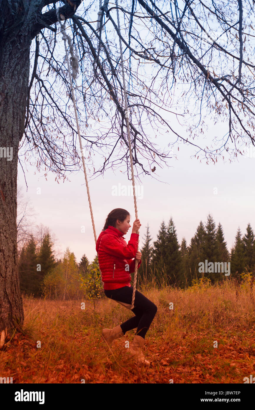 Girl on swing in park, Chusovoy, Russia Stock Photo