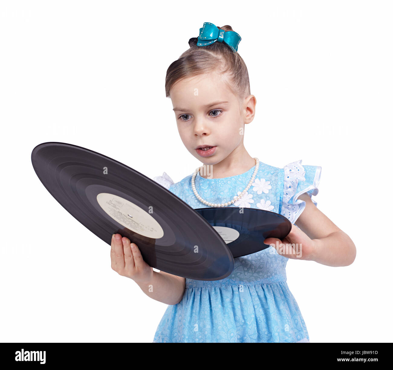 Little girl looks at vinyl records Stock Photo