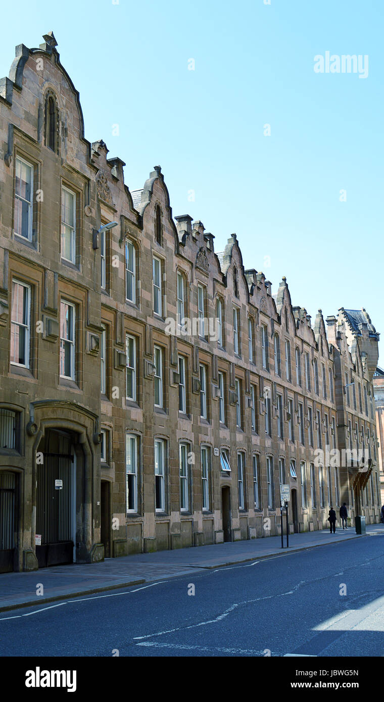 Merchant City: an eccentric 23 bay warehouse built in Scotch Baronial style on Ingram Street, Glasgow, Scotland, in 1859 and now converted to flats. Stock Photo