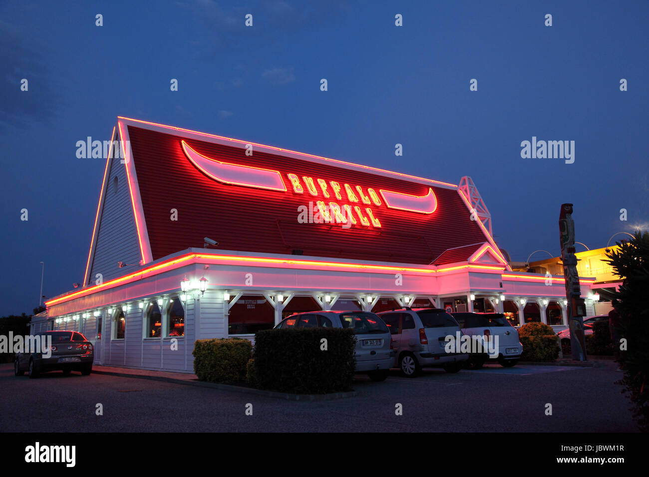 Buffalo Grill Restaurant illuminated at dusk. Buffalo Grill is a chain
