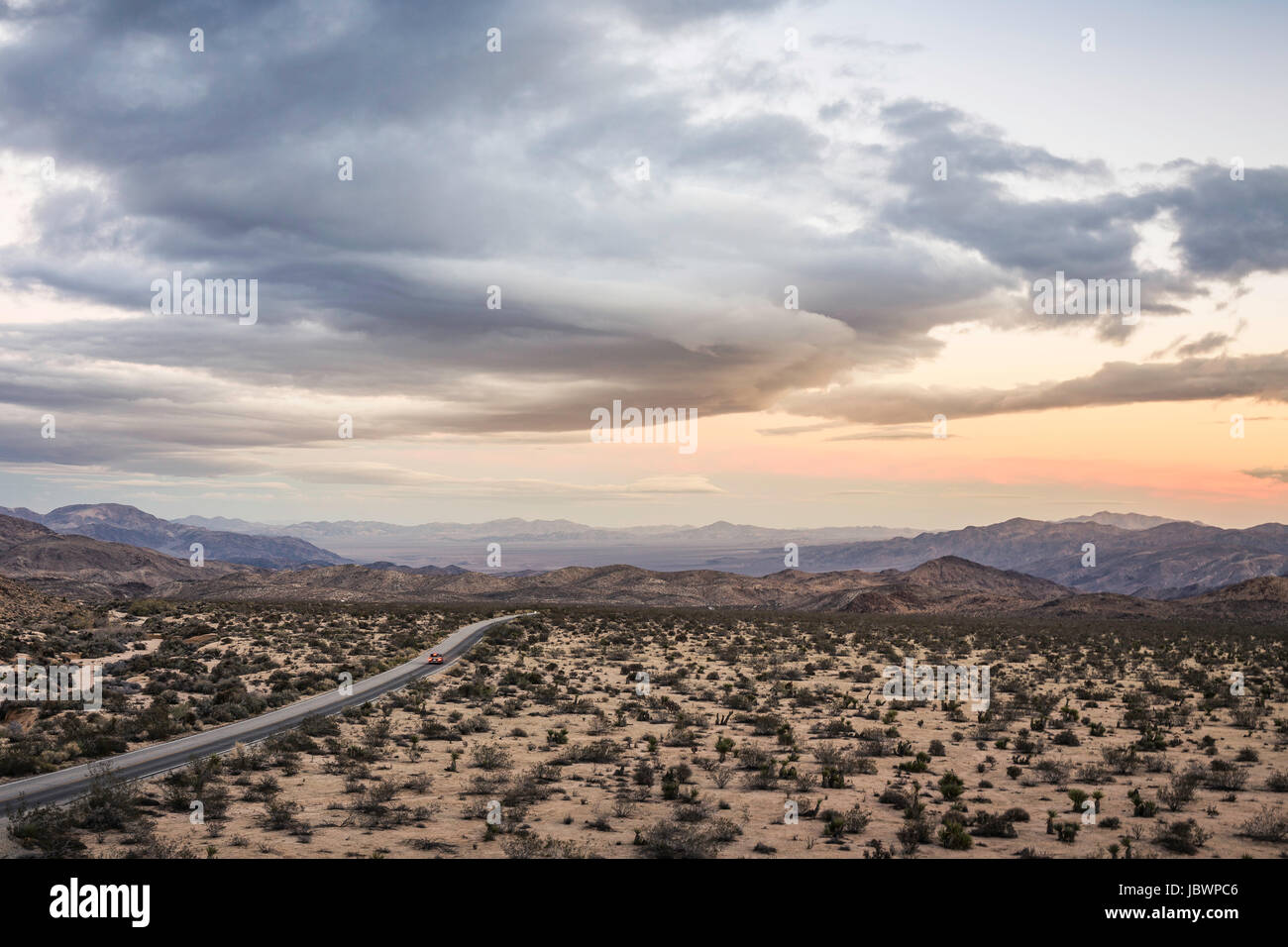 Landscape view of distant highway in Joshua Tree National Park at dusk, California, USA Stock Photo