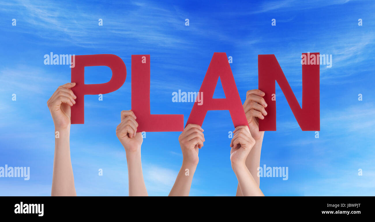 Many People Holding the Word Plan in the Sky Stock Photo