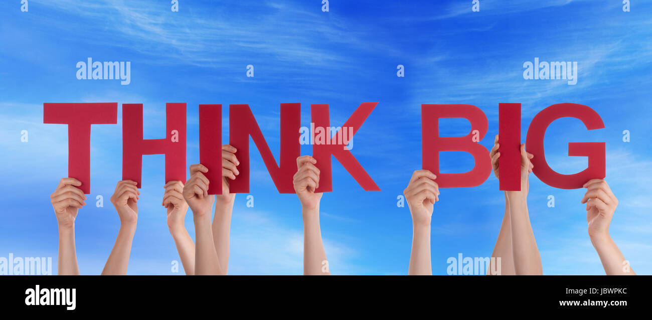Think Many Many People Holding the Words Think Big in the Sky Stock Photo - Alamy