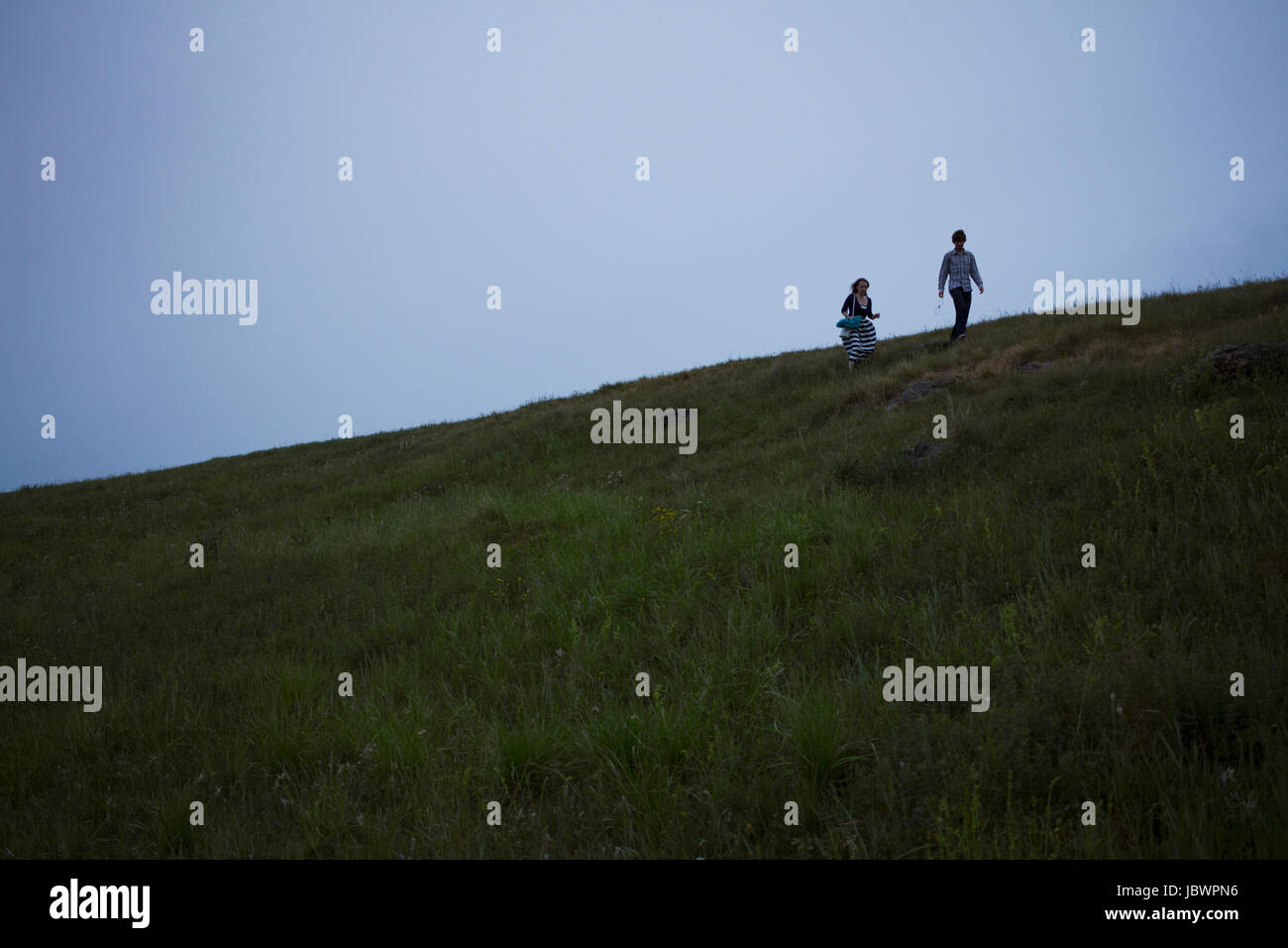 Couple strolling through countryside Stock Photo