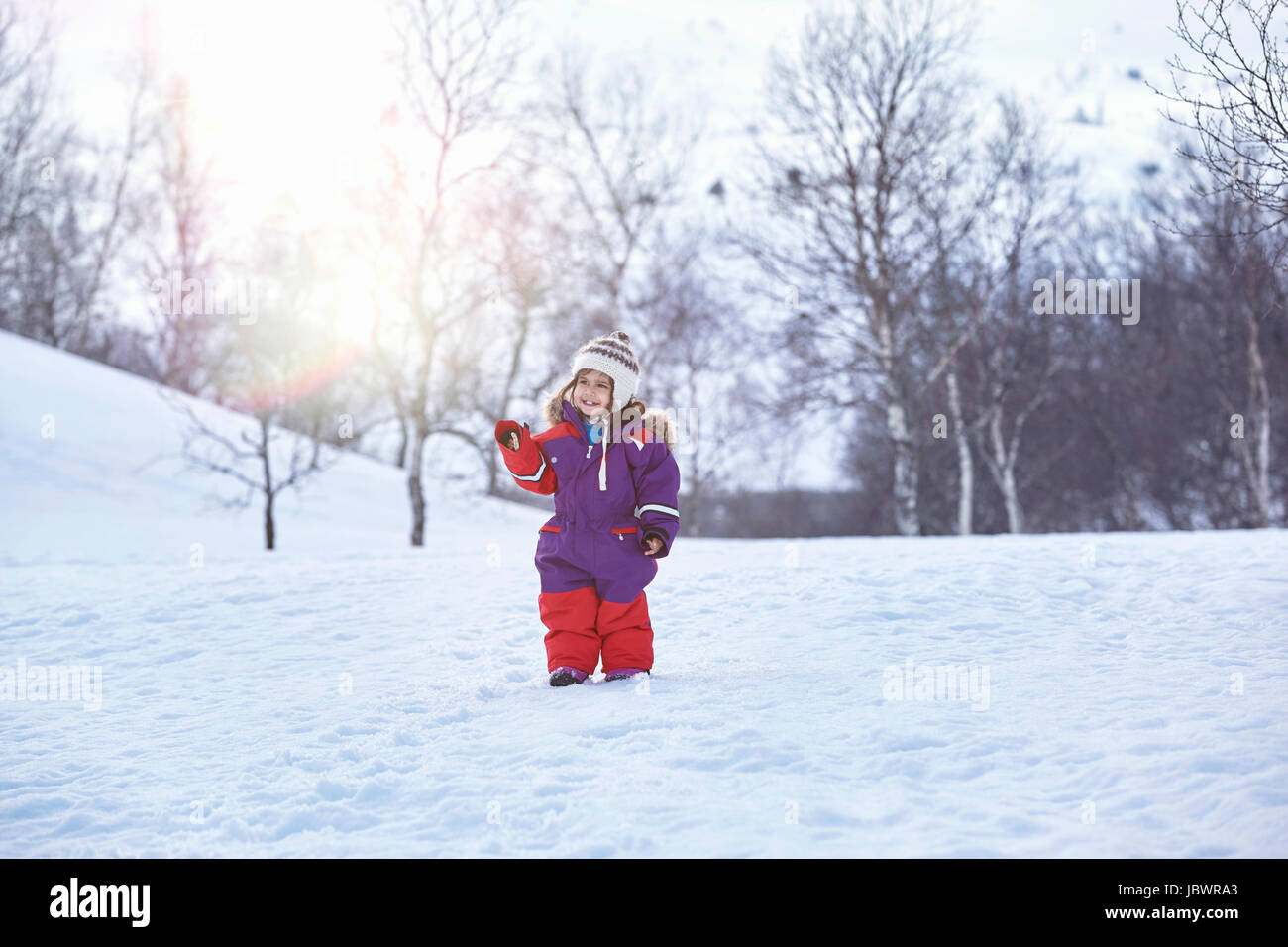 Portrait of young girl, standing in snowy landscape, Gjesdal, Norway Stock Photo