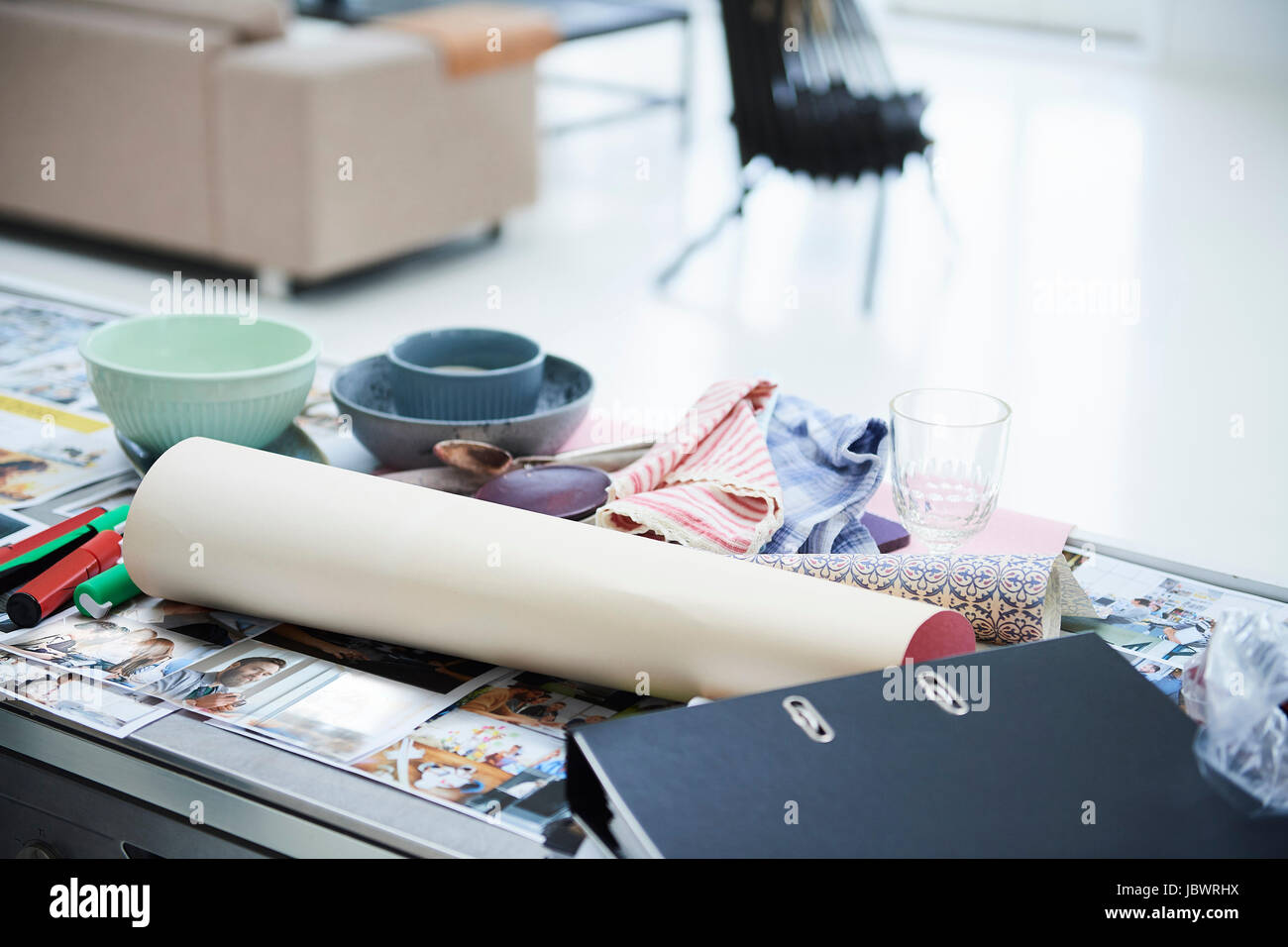 Design studio desk with photographs, file and swatches Stock Photo - Alamy
