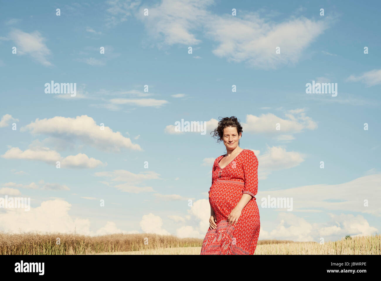 Pregnant mother wearing blue hi-res stock photography and images - Alamy